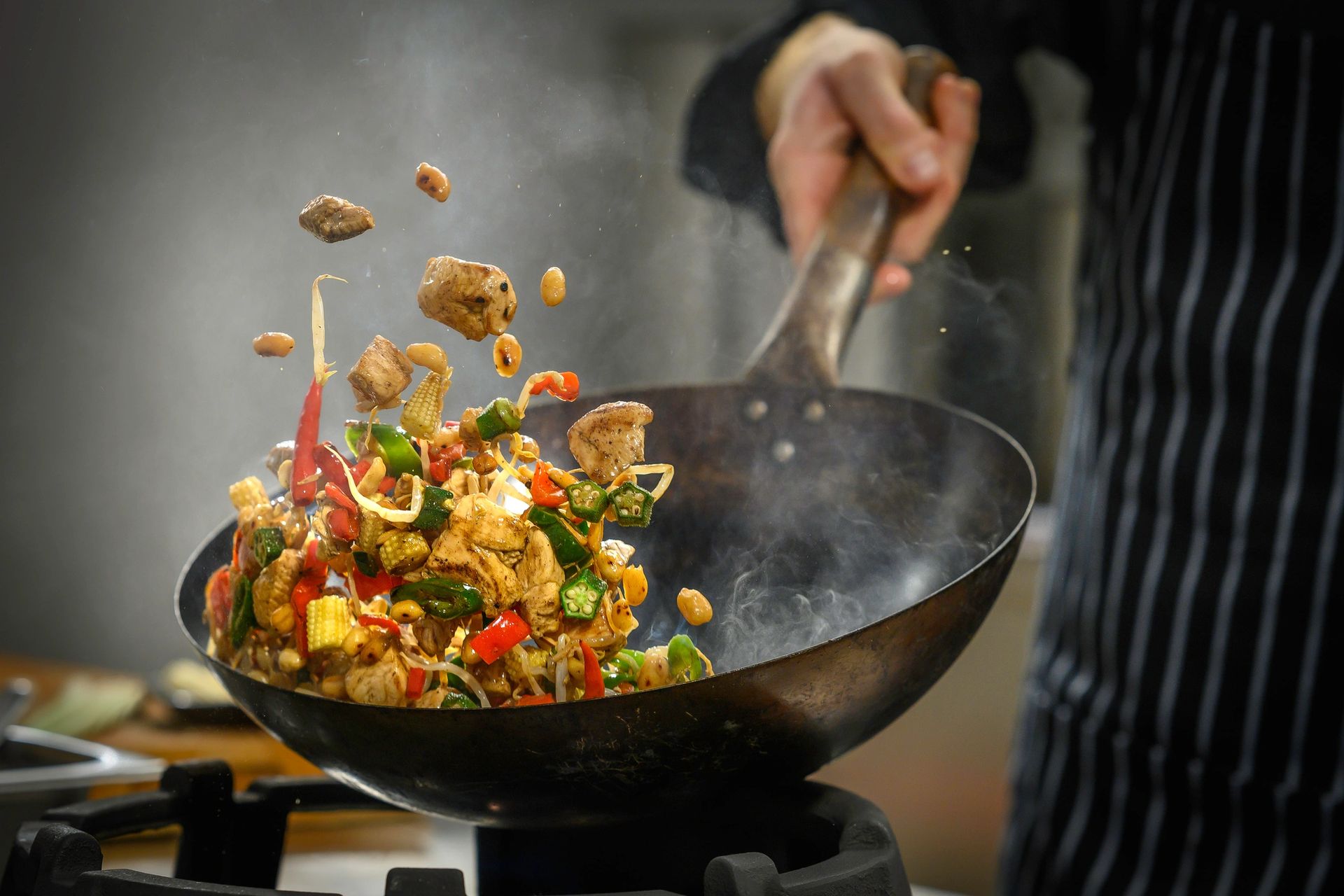 Chef preparing food in the Copper Wok kitchen